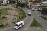 Ambulances drive towards the military base where a car bomb exploded in Cucuta, Colombia, Tuesday, June 15, 2021. Colombian authorities still have not confirmed how many were injured in the explosion. (AP Photo/Ferley Ospina)