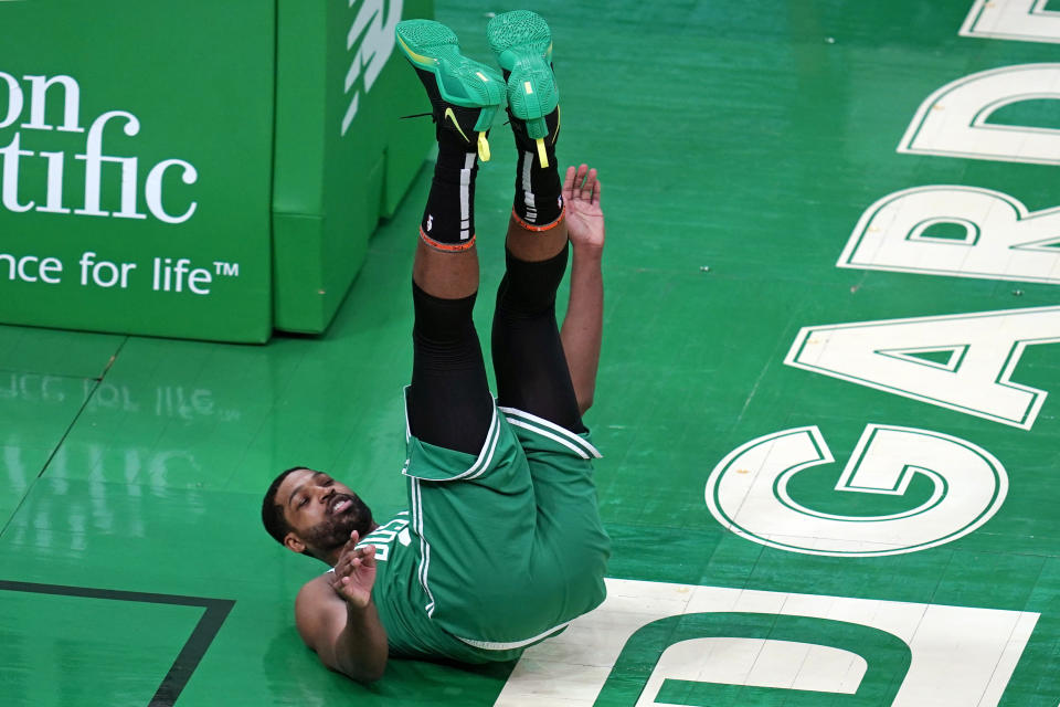 Boston Celtics center Tristan Thompson (13) is upended after block by New York Knicks center Nerlens Noel during the first half of an NBA basketball game Wednesday, April 7, 2021, in Boston. (AP Photo/Charles Krupa)