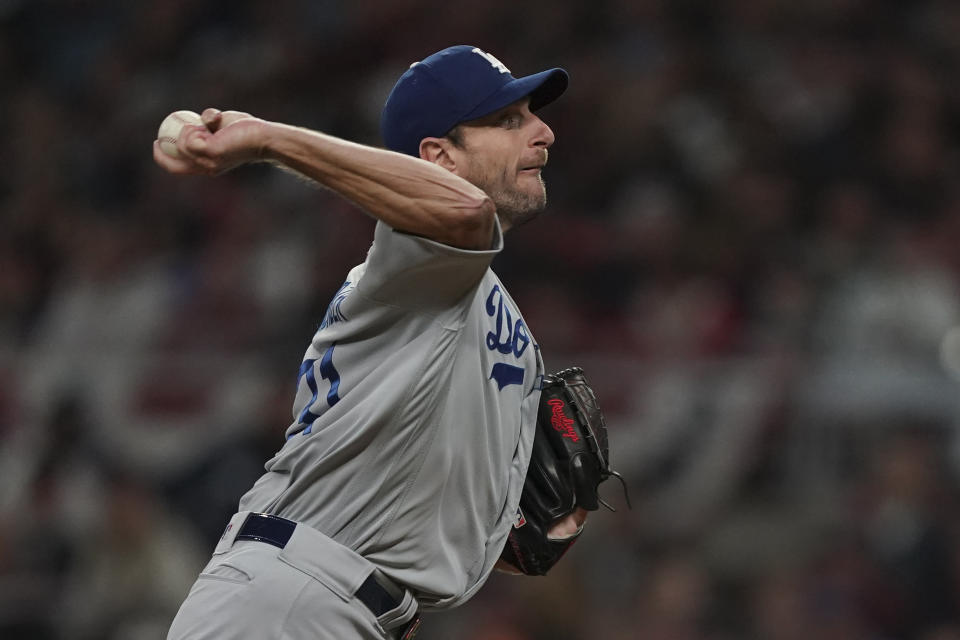 Los Angeles Dodgers starting pitcher Max Scherzer throws against the Atlanta Braves during gate second inning in Game 2 of baseball's National League Championship Series Sunday, Oct. 17, 2021, in Atlanta. (AP Photo/Brynn Anderson)