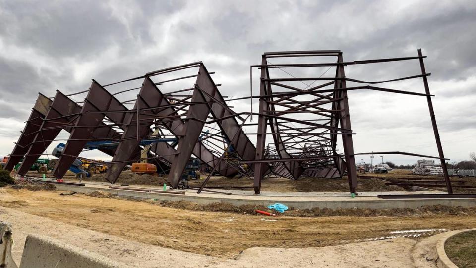 Twisted girders with a crane in the center, the morning after the collapse.