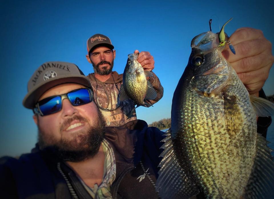 Shane Cribbs, left, of Eagle Lake and Joshua Dunn of Mulberry, show off a couple of slab specks out of a boat limit they caught on Toad Thumpers Jigs while fishing the South Winter Haven Chain last week.