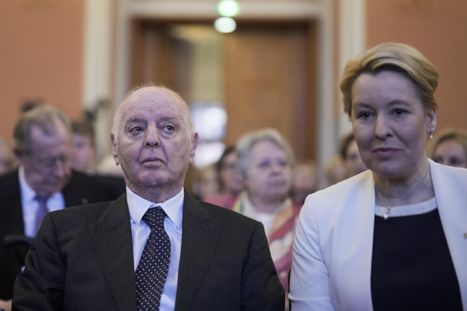 Pianist and conductor Daniel Barenboim, left, arrives with Berlin Mayor Franziska Giffey, right, for a ceremony to award him honorary citizenship of the German capital in Berlin, Germany, Friday, April 21, 2023. Barenboim stepped down as the Berlin’s State Opera’s music director after 30 years in February for health reasons. (AP Photo/Markus Schreiber)