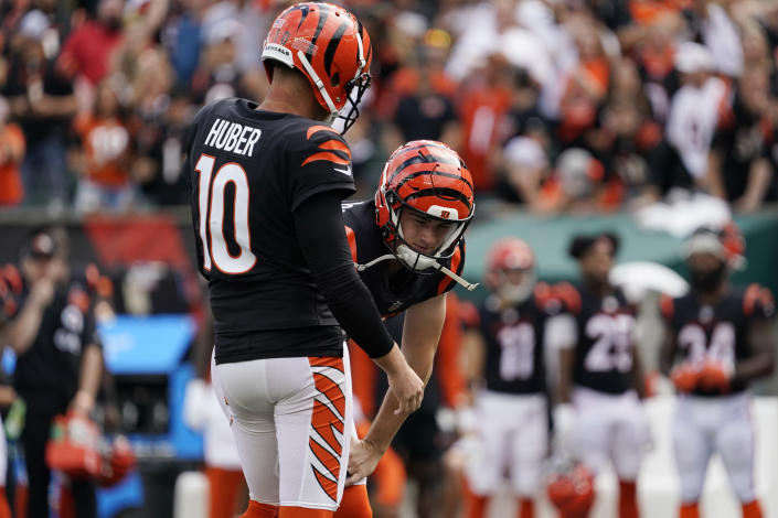 Cincinnati Bengals placekicker Evan McPherson, right, reacts after missing a field goal out of the hold of punter Kevin Huber (10) during overtime of an NFL football game against the Pittsburgh Steelers, Sunday, Sept. 11, 2022, in Cincinnati. (AP Photo/Joshua A. Bickel)