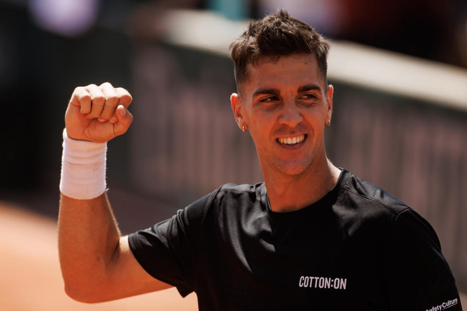 Thanasi Kokkinakis celebrates at the French Open.