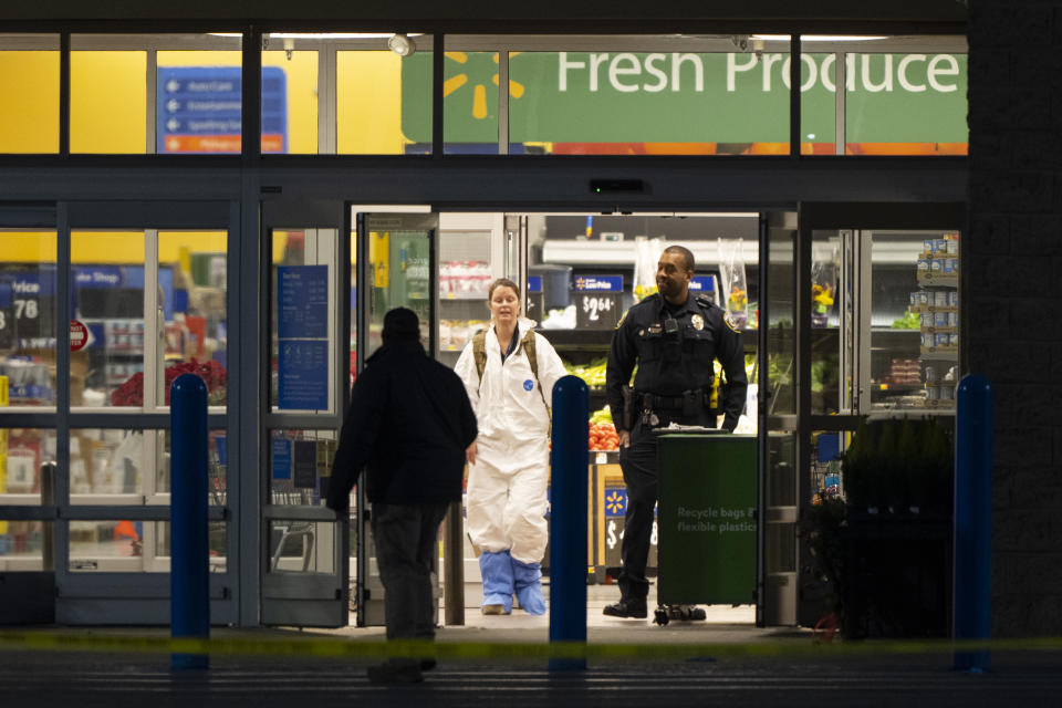 Investigators at the Walmart in Chesapeake, Va.