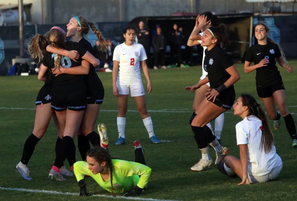 Clovis North players celebrate a goal by No. 16 Braedyn Kincade in the second oveterime period of a CIF Central Section Division I girls soccer semifinal on Feb. 21, 2023. Clovis North won, 2-1, in overtime to advance to the championship match.