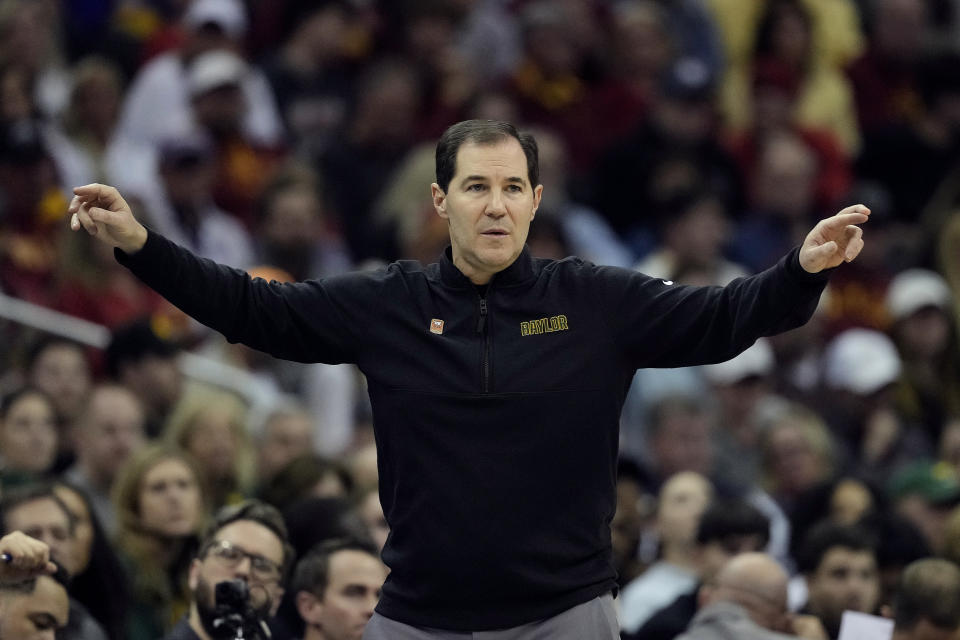 Baylor head coach Scott Drew motions to his players during the first half of an NCAA college basketball game against Iowa State in the semifinal round of the Big 12 Conference tournament, Friday, March 15, 2024, in Kansas City, Mo. Houston won 82-59. (AP Photo/Charlie Riedel)