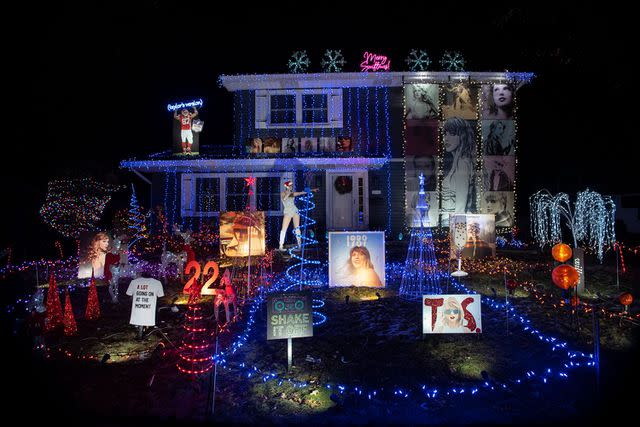 <p>Joeff Davis/Shutterstock</p> A home in Naperville, Illinois, a suburb of Chicago, is covered in Taylor Swift pictures, lyrics and blown up album covers along with holiday lights.