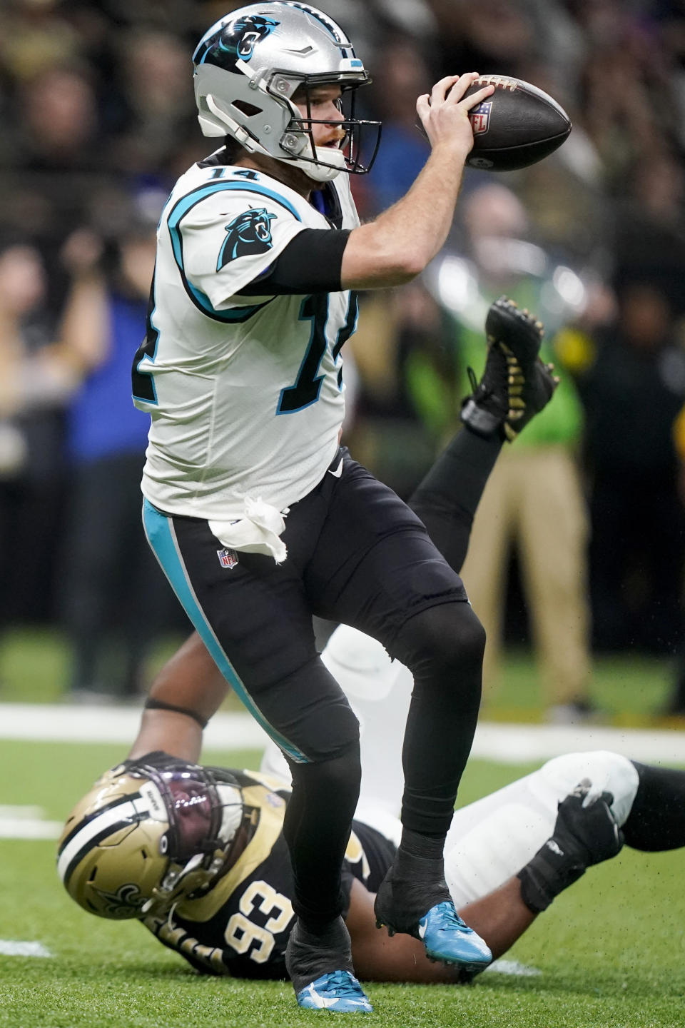 Carolina Panthers quarterback Sam Darnold looks to throw past New Orleans Saints defensive tackle David Onyemata during the first half an NFL football game between the Carolina Panthers and the New Orleans Saints in New Orleans, Sunday, Jan. 8, 2023. (AP Photo/Gerald Herbert)