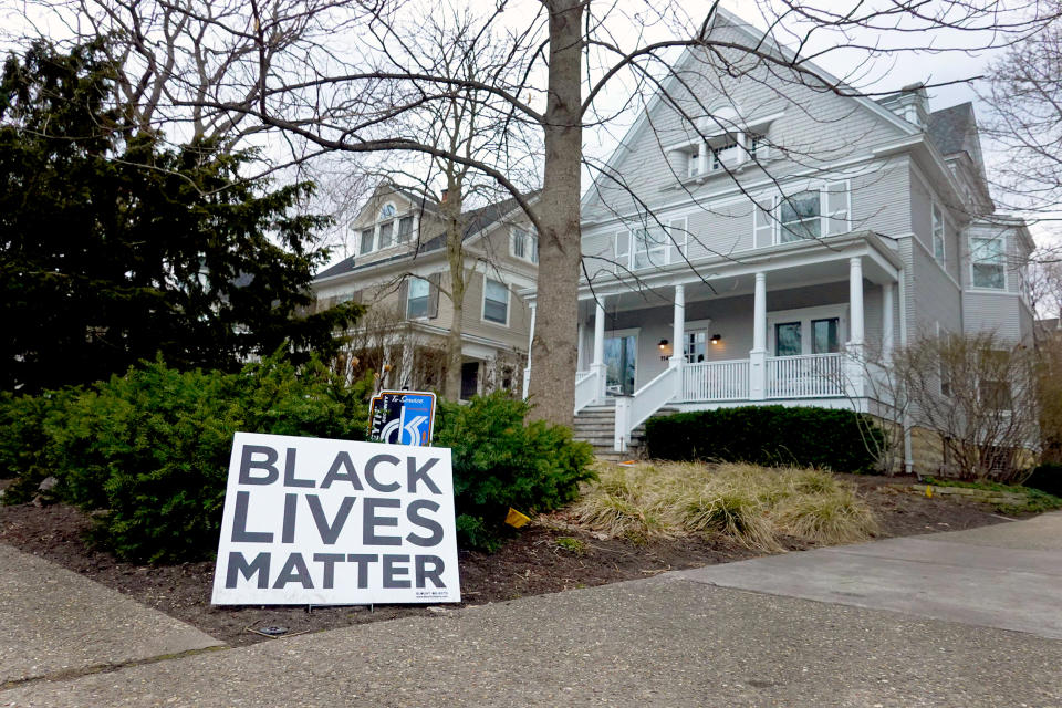 Image: A Black Lives Matter sign sits in front of a home on March 23, 2021 in Evanston, Ill. (Scott Olson / Getty Images)