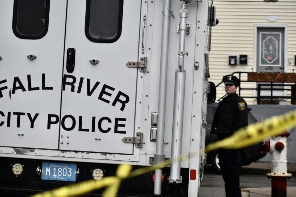 Police tape surrounds the Bank Street area where two men were killed in a shooting early Wednesday, Dec. 7, in Fall River.