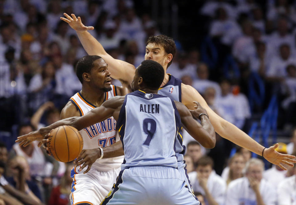 Oklahoma City Thunder forward Kevin Durant (35) is double teamed by Memphis Grizzlies center Marc Gasol and guard Tony Allen (9) in the second quarter of Game 5 of an opening-round NBA basketball playoff series in Oklahoma City, Tuesday, April 29, 2014. (AP Photo)