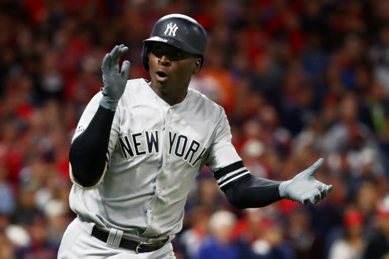 Didi Gregorius of the New York Yankees celebrates as he runs the bases after hitting a solo home run in the first inning against the Cleveland Indians, in game five of the American League Divisional Series, in Cleveland, Ohio, on October 11, 2017