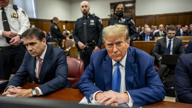 Donald Trump sits in a courtroom