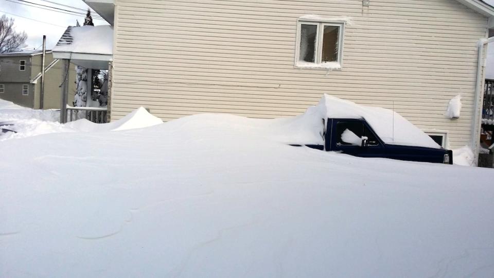 A snow-covered truck in Middle Sackville, N.S. Not pictured: the Mazda 5 parked at the tailgate of the truck. 