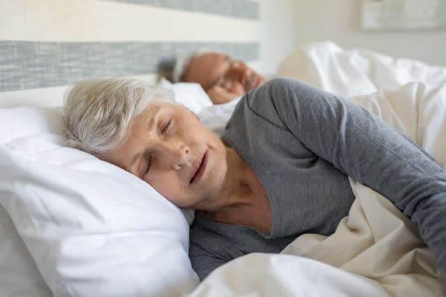 Senior couple sleeping