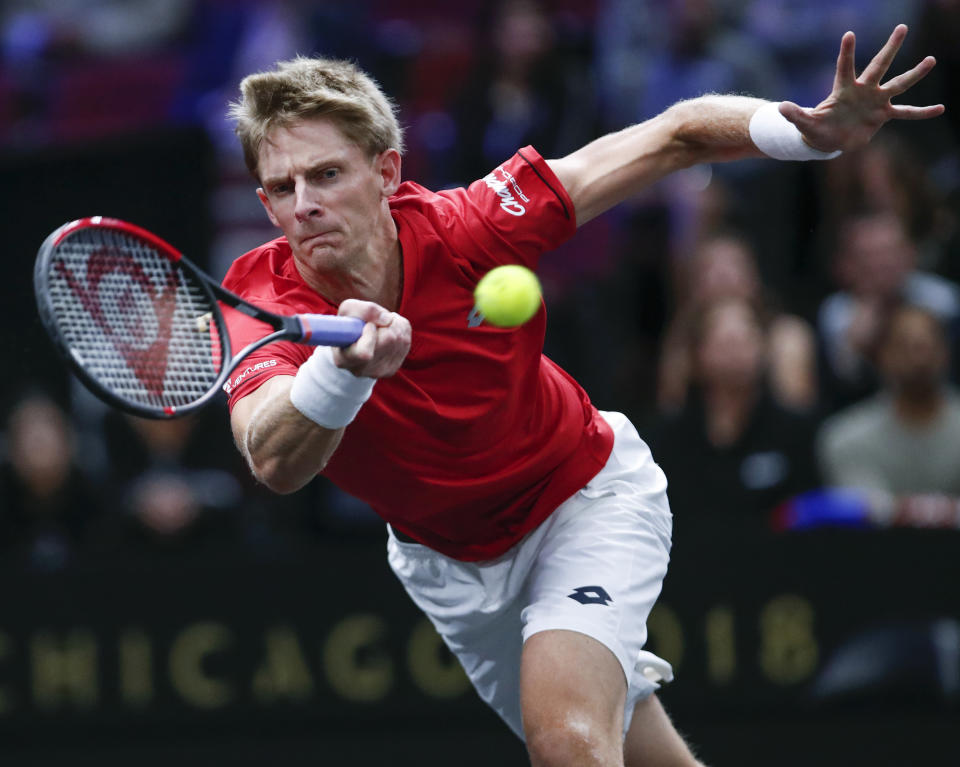 Team World's Kevin Anderson hits a return to Team Europe's Novak Djokovic at the Laver Cup tennis event, Saturday, Sept. 22, 2018, in Chicago. (AP Photo/Kamil Krzaczynski)