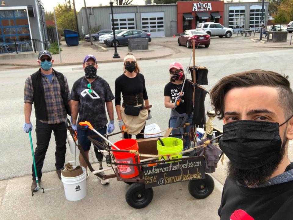 Members of the Fairmount Trash Pirates gather for a picture during a cleanup in December. The group built its pirate ship wagon in September and has picked up hundreds of pounds of litter since.