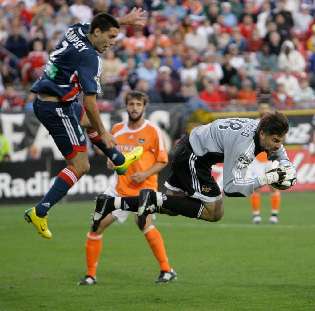 Houston Dynamo goalkeeper Pat Onstad goes flying after blocking a scoring-attempt by Clint Dempsey in the 2006 MLS Cup.