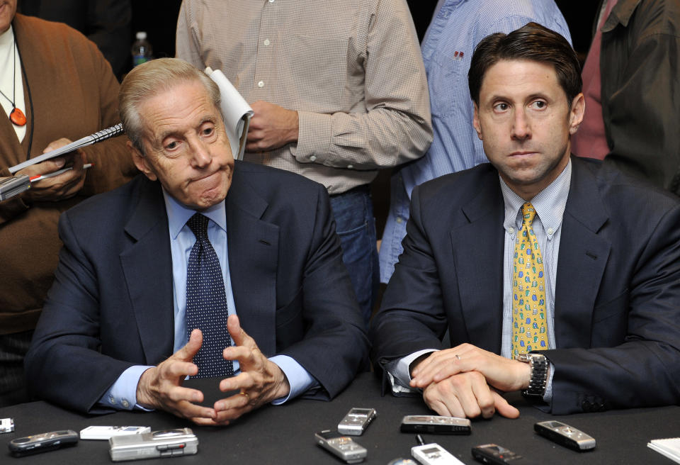 FILE - In this Oct. 29, 2010, file photo, New York Mets owner Fred Wilpon, left, and COO Jeff Wilpon, listen to a question from the media during a baseball news conference in New York. A judge has ruled that owners of the New York Mets owe up to $83 million to the trustee recovering money for Bernard Madoff investors. Federal Judge Jed Rakoff in Manhattan ruled Monday, March 5, 2012, that there will still be a trial on whether additional money is owed. But he expressed doubt that the Mets would owe more. (AP Photo/Kathy Kmonicek, File)