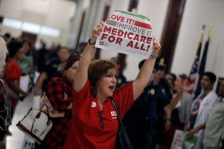 FILE PHOTO: Healthcare activists protest against the Republican healthcare bill on Capitol Hill in Washington, U.S., July 19, 2017. REUTERS/Aaron P. Bernstein