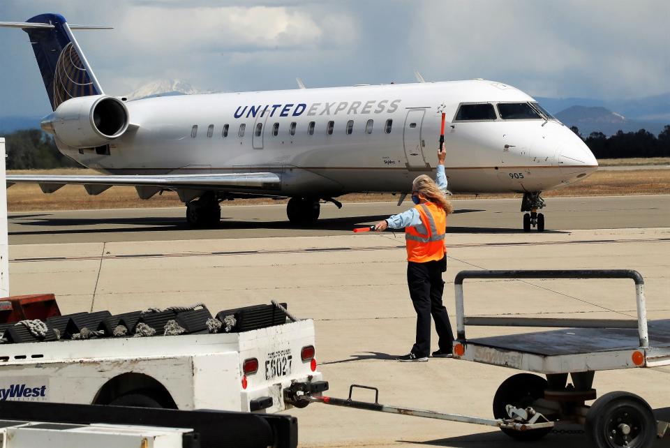 A United Express jet taxis after landing at Redding Regional Airport on May 20, 2021.