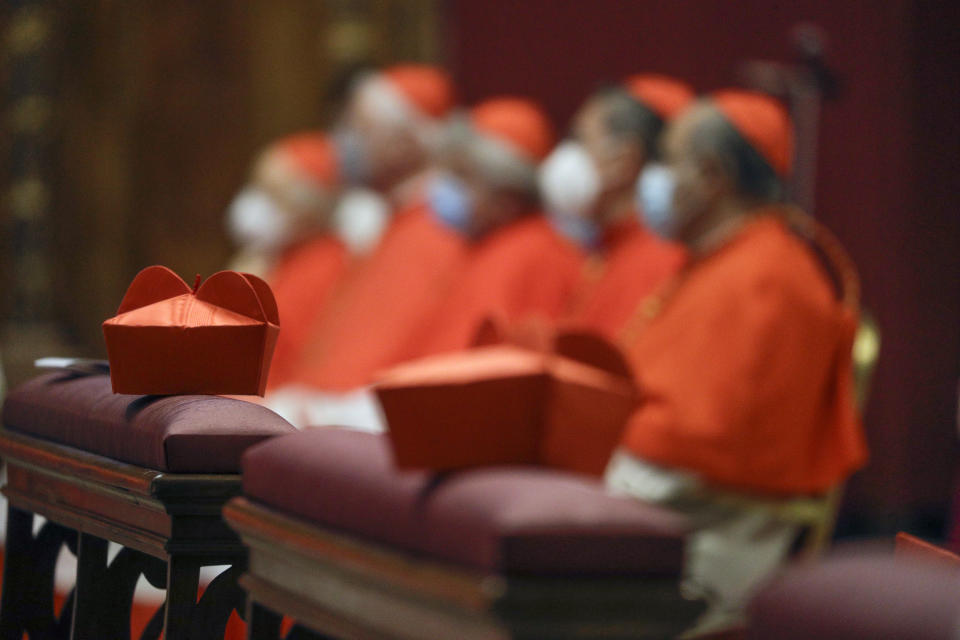 Cardinals sit as Pope Francis celebrates Mass the day after he raised 13 new cardinals to the highest rank in the Catholic hierarchy, at St. Peter's Basilica, Sunday, Nov. 29, 2020. (AP Photo/Gregorio Borgia, Pool)