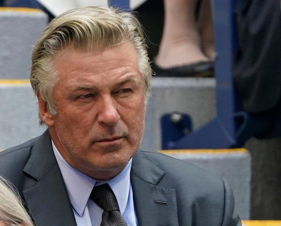 In this Sept. 12 photo Alec Baldwin watches the men's singles final of the US Open tennis championships in New York. A prop firearm discharged by veteran actor Alec Baldwin, who is starring and producing a Western movie, killed his director of photography and injured the director Oct. 21 at the movie set outside Santa Fe, N.M., the Santa Fe County Sheriff’s Office said.