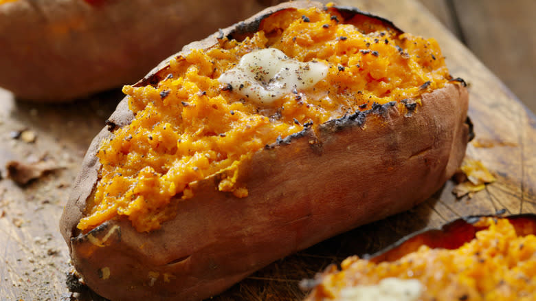 Baked sweet potatoes with butter melting