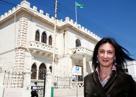 Maltese investigative journalist Daphne Caruana Galizia poses outside the Libyan Embassy in Valletta April 6, 2011. Investigative journalist Caruana Galizia was killed after a powerful bomb blew up a car killing her in Bidnija, Malta, in October 16, 2017. Picture taken April 6, 2011. REUTERS/Darrin Zammit Lupi