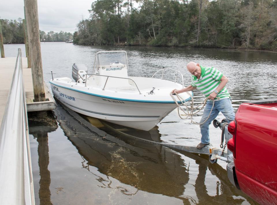 Michael Pickard, of Milton, gets set to launch his boat at Carpenter's Park near the Milton Marina on Feb. 6, 2019. The city has been acquiring parcels on either side of the Milton Marina for a project to revitalize the Blackwater riverfront.