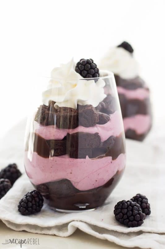 <p>The Recipe Rebel</p><p>If you’re looking for a yummy dessert while keeping with the rest of your eerie decor, follow <a href="https://www.thereciperebel.com/chocolate-blackberry-cheesecake-trifles/" rel="nofollow noopener" target="_blank" data-ylk="slk:The Recipe Rebel;elm:context_link;itc:0;sec:content-canvas" class="link rapid-noclick-resp">The Recipe Rebel</a>’s take on cheesecake trifles that guests will savor every spoonful. </p>