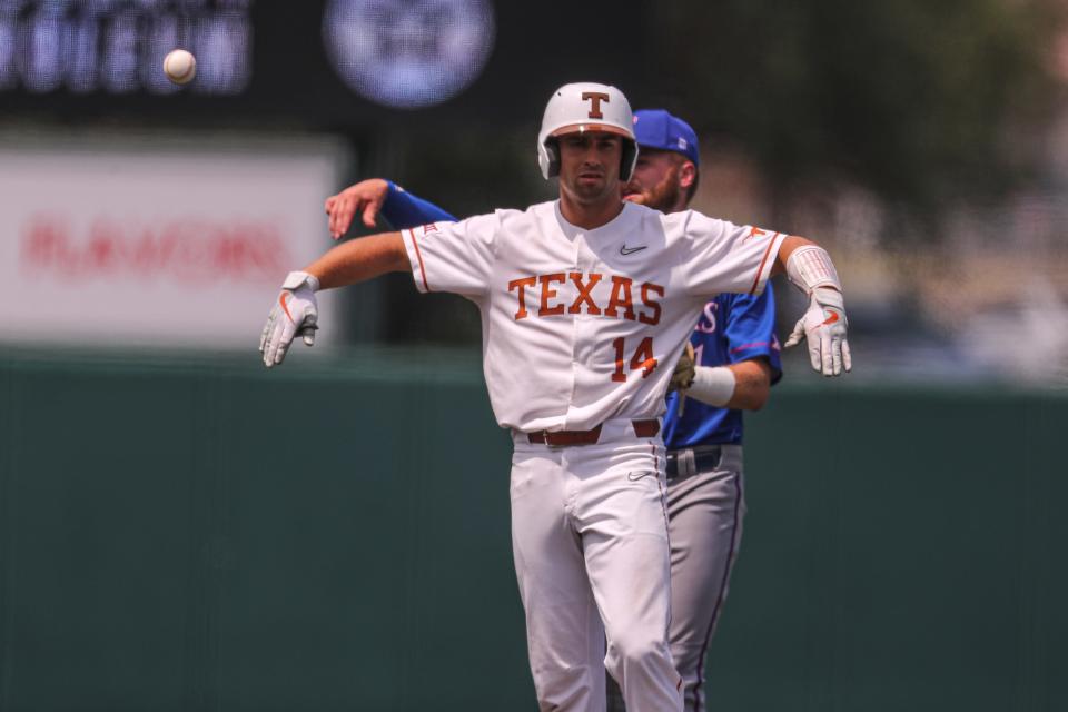 Texas infielder Murphy Stehly flaps his arm after hitting a double against Kansas on May 21. Hitting for power is nothing new to Stehly, who has 17 home runs this season, but playing in the NCAA Tournament is; he played in only one of Texas' 10 NCAA games last season.