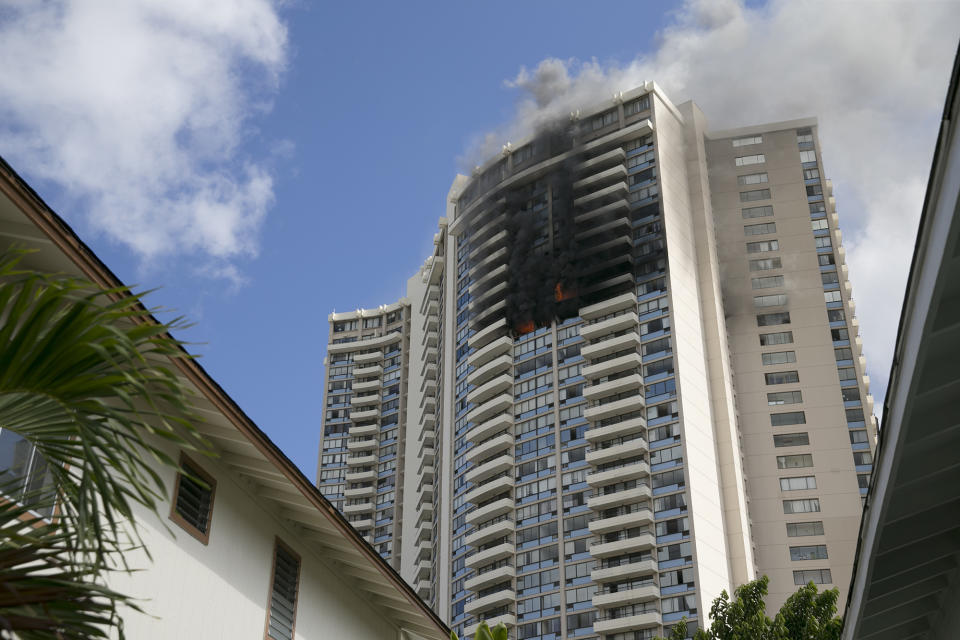 Smoke billows from the upper floors