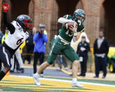 William & Mary's wide receiver JT Mayo makes a touchdown catch as Gardner-Webb's cornerback Raequan Ousley during the first half of an FCS playoffs NCAA college football game at The College of William and Mary in Williamsburg, Va. on Saturday, Dec. 3, 2022. (Daniel Sangjib Min/Richmond Times-Dispatch via AP)