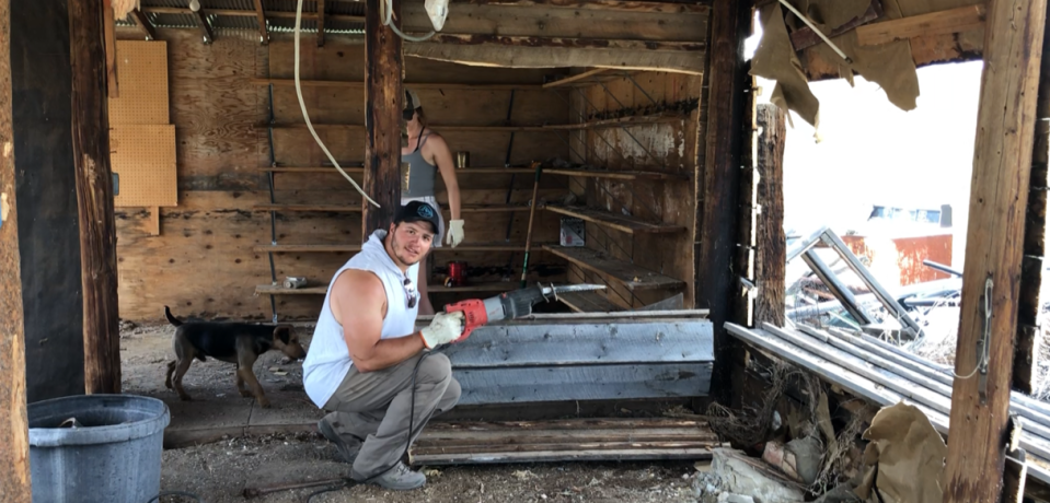 Jaguars defensive tackle Taven Bryan carries a Sawzall tool while tearing down dilapidated buildings at the site of the RV park he acquired with his family in Wyoming.