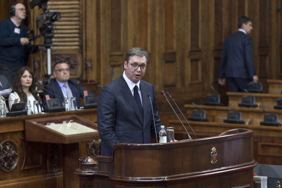 Aleksandar Vucic, the president of Serbia, center, spaks during a session of Serbia's parliament in Belgrade, Serbia Monday, May 27, 2019. Vucic addressed the Serb parlamentarians during a session devoted to the situation in Kosovo, which declared independence from Serbia in 2008. (AP Photo/Marko Drobnjakovic)