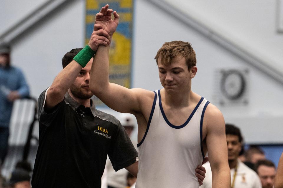 Sanford senior Justin Griffith gets his arm raised after his 1st Place win over Cape Henlopen senior Alex Taylor during the 190 pounds championship finals of the DIAA Individual Wrestling State Tournament at Cape Henlopen High in Lewes, Saturday, March 4, 2023.