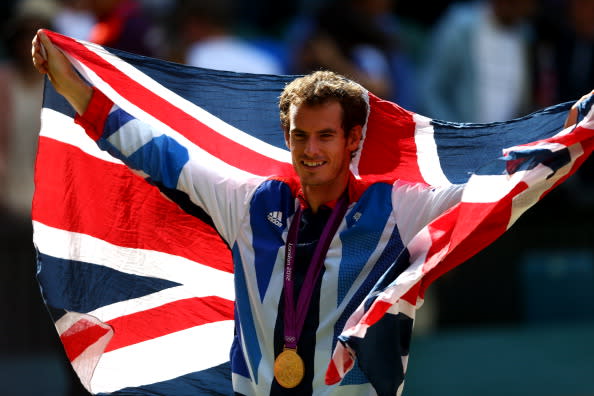 Gold medalist Andy Murray of Great Britain poses during the medal ceremony for the Men's Singles Tennis match on Day 9 of the London 2012 Olympic Games at the All England Lawn Tennis and Croquet Club on August 5, 2012 in London, England. Murray defeated Federer in the gold medal match in straight sets 2-6, 1-6, 4-6. (Photo by Paul Gilham/Getty Images)