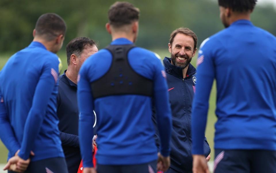 Southgate speaks with his players after a training session - GETTY IMAGES