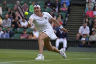 Tunisia's Ons Jabeur returns to Marie Bouzkova of the Czech Republic in a women's singles quarterfinal match on day nine of the Wimbledon tennis championships in London, Tuesday, July 5, 2022. (AP Photo/Alastair Grant)