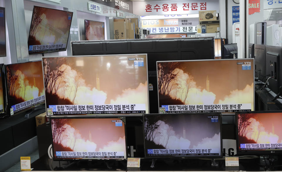TV screens showi a news program reporting about North Korea's missiles with file footage at an electronic shop in Seoul, South Korea, Thursday, March 25, 2021. North Korea on Thursday test-fired its first ballistic missiles since U.S. President Joe Biden took office, as it expands its military capabilities and increases pressure on Washington while nuclear negotiations remain stalled. The Korean characters read: "Joint Chiefs of Staff, South Korea and U.S. intelligence authorities, analyzing the missiles in detail." (AP Photo/Lee Jin-man)