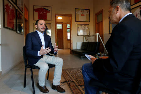 Jordan's Prince Ali Bin Al Hussein (L), president of the Jordanian Football Association, speaks with Reuters journalist Suleiman al-Khalidi during an interview, in Amman, Jordan, October 23, 2016. Picture taken October 23, 2016. To match Interview SOCCER-FIFA/PRINCE ALI REUTERS/Muhammad Hamed