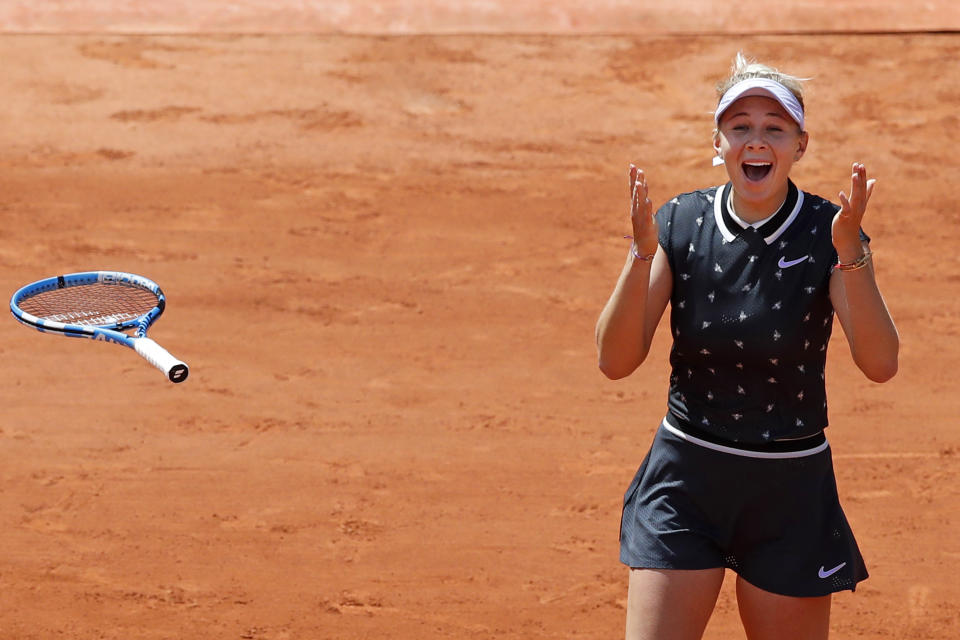 Amanda Anisimova of the U.S. celebrates winning her quarterfinal match of the French Open tennis tournament against Romania's Simona Halep in two sets, 6-2, 6-4, at the Roland Garros stadium in Paris, Thursday, June 6, 2019. (AP Photo/Christophe Ena)