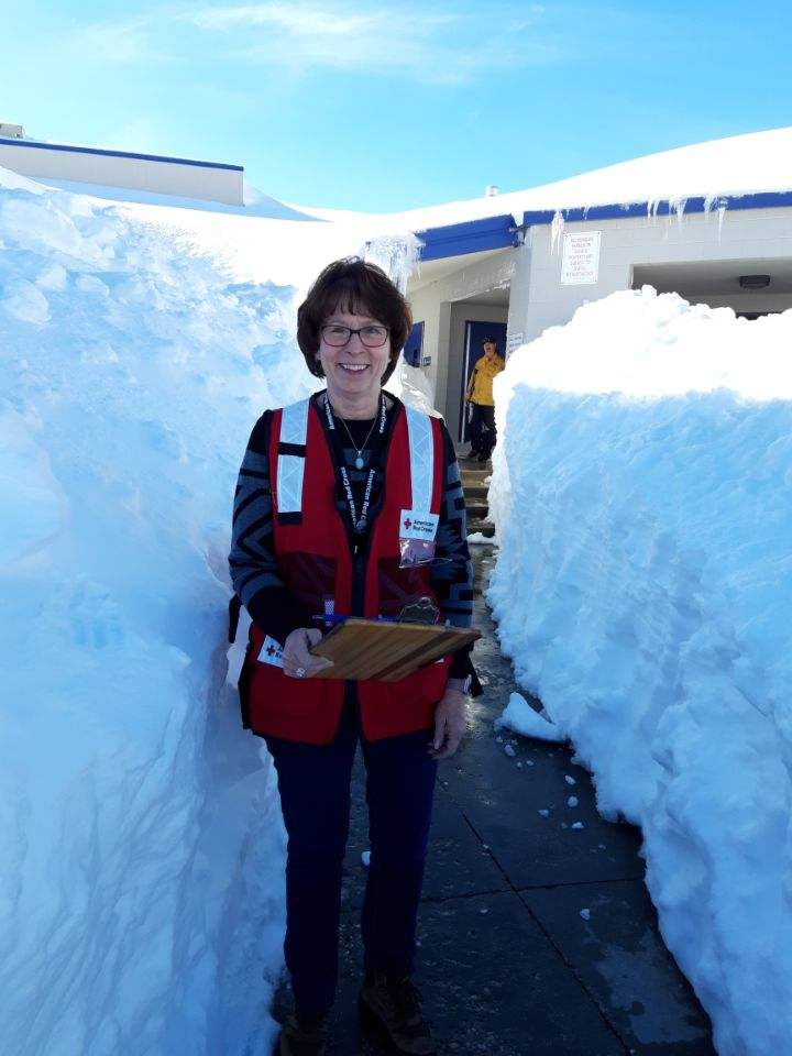 An American Red Cross worker at a shelter at  
Rim of the World High School in Lake Arrowhead. Volunteers are providing a safe place to stay, food and drinks.