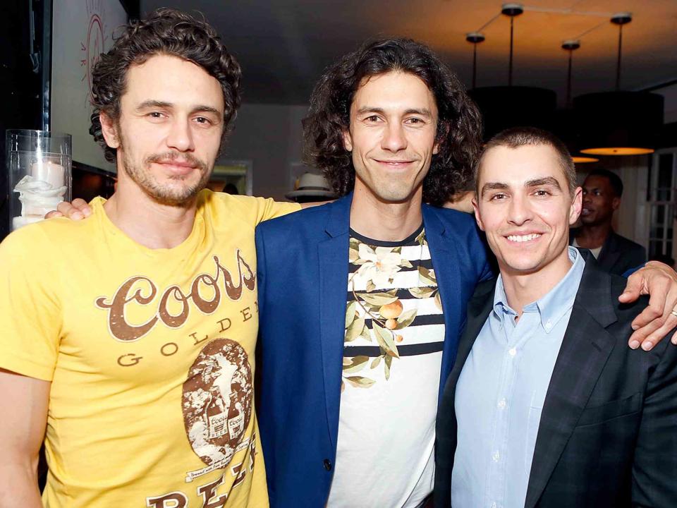 <p>Randy Shropshire/Getty</p> James Franco, Tom Franco and Dave Franco attend the Art of Elysium presents Tom Franco at the art salon