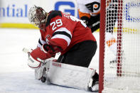 New Jersey Devils goaltender MacKenzie Blackwood blocks a shot from the Philadelphia Flyers during the first period of an NHL hockey game, Saturday, Jan. 12, 2019, in Newark, N.J. (AP Photo/Julio Cortez)