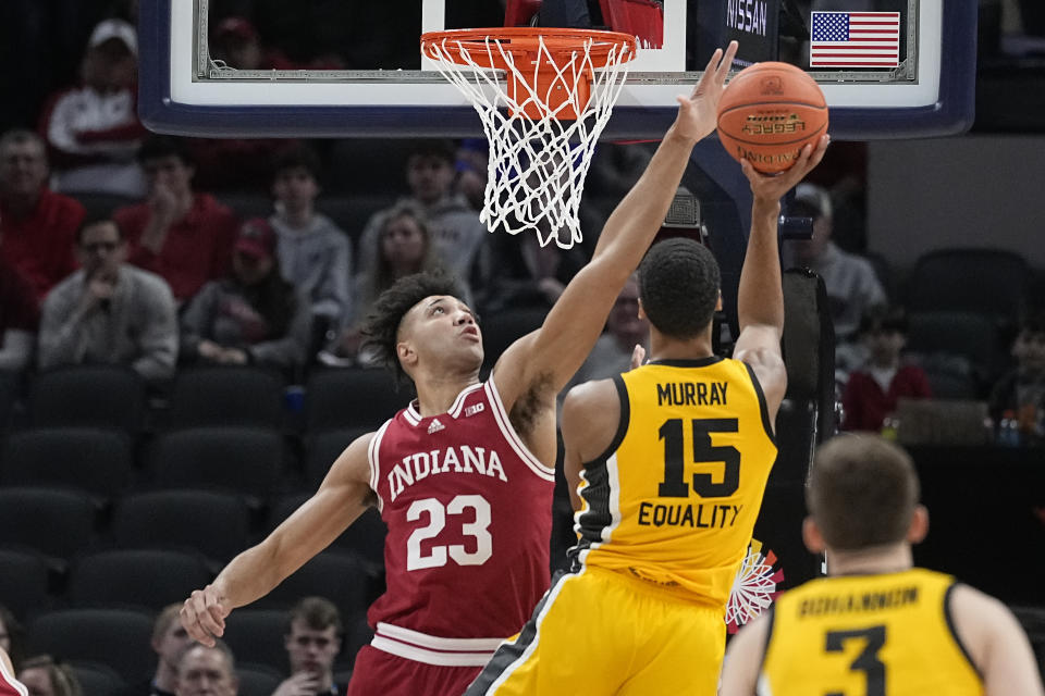 FILE - Indiana's Trayce Jackson-Davis (23) blocks the shot of dIowa's Keegan Murray (15) during the first half of an NCAA college basketball game in the semifinal round at the Big Ten Conference tournament, Saturday, March 12, 2022, in Indianapolis. Indiana returns to the NCAA tournament for the first time since 2016 and in the first season with a new coach, Mike Woodson. The Hoosiers (20-13) face a Wyoming team from the Mountain West that finished 25-8 and also earned an at-large bid. (AP Photo/Darron Cummings, File)