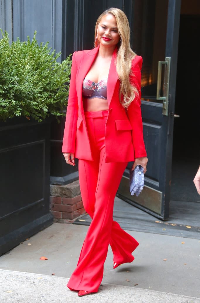 Chrissy Teigen is snapped leaving her hotel in Soho Wednesday morning. - Credit: Splash News