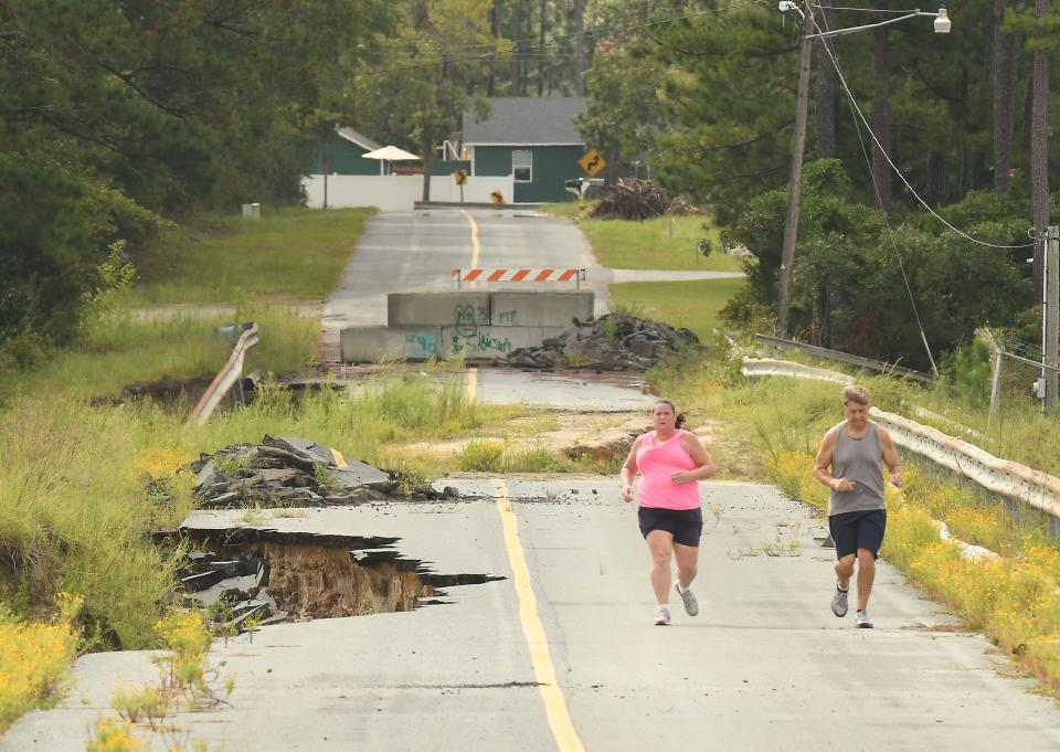 The dam at Boiling Spring Lakes' big lake has yet to be repaired four years after it was washed away by Hurricane Florence.